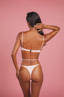 Kaia plunge one-piece swimsuit high-cut Brazilian bottom — back view