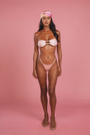 She Wears Pearls ruched strapless bandeau top in Glossy Peach with pearl detail — front view