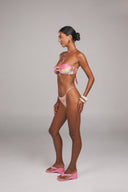 She Wears Pearls ruched strapless bandeau top in Pastel Retro Swirl with pearl detail — front view